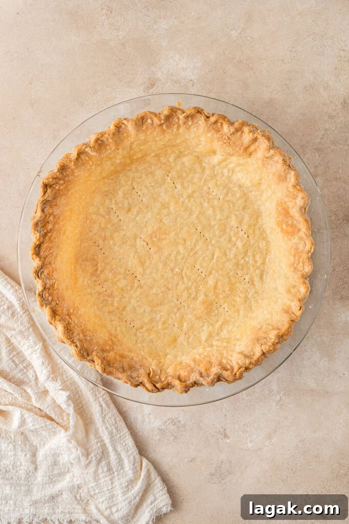 Creamy Dairy-Free Pumpkin Pie Recipe for Fall Celebrations 6 The baked pie crust in the pie dish.