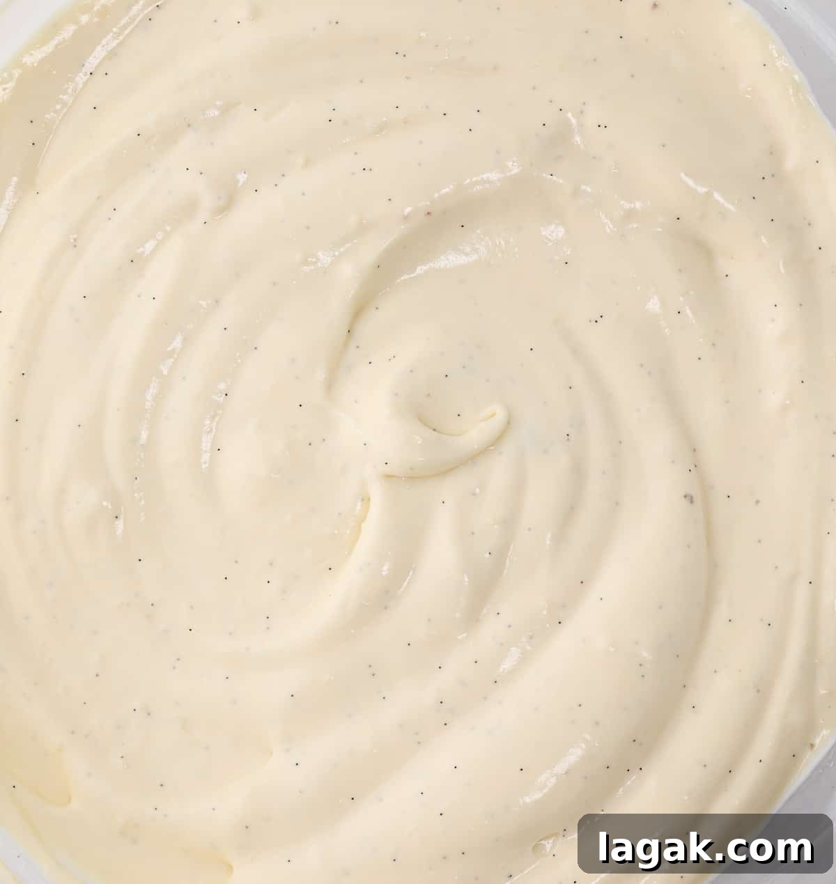 Bavarian Cream Recipe: Silky Crème Bavaroise Made at Home 6 Cream in a mixing bowl seen from above.