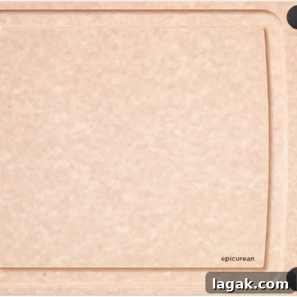 A rectangular, light brown cutting board with a smooth surface, four black non-slip corners, and a small hole on the left side.