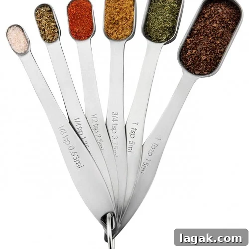A set of six metal measuring spoons