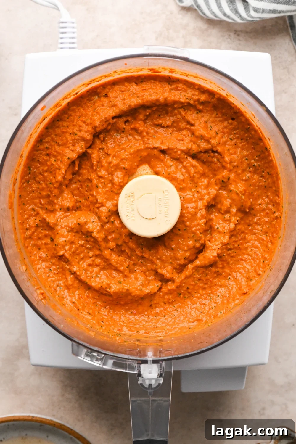 10-Minute Rustic Romesco Sauce (Dairy-Free) 7 How to make Dairy Free Romesco Sauce: All ingredients in the container of a food processor after pulsing to combine.