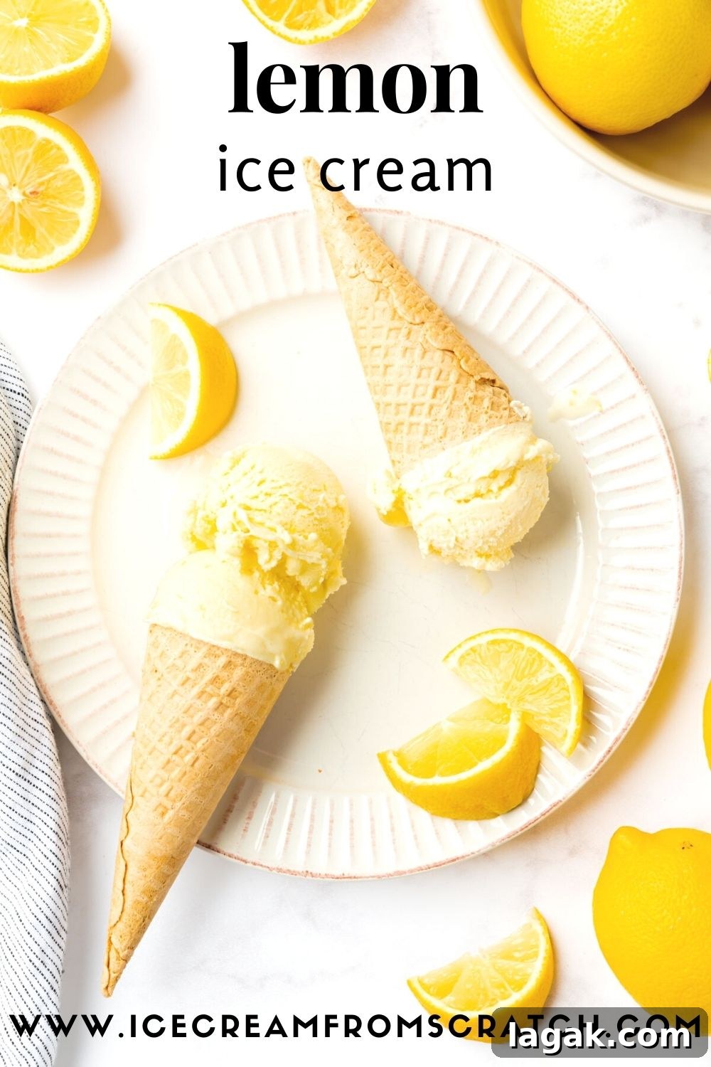 Creamy Lemon Ice Cream Recipe: Zesty Homemade Frozen Treat 7 a white fluted plate holding two sugar cones of homemade lemon ice cream, garnished with lemon wedges. Viewed from above.
