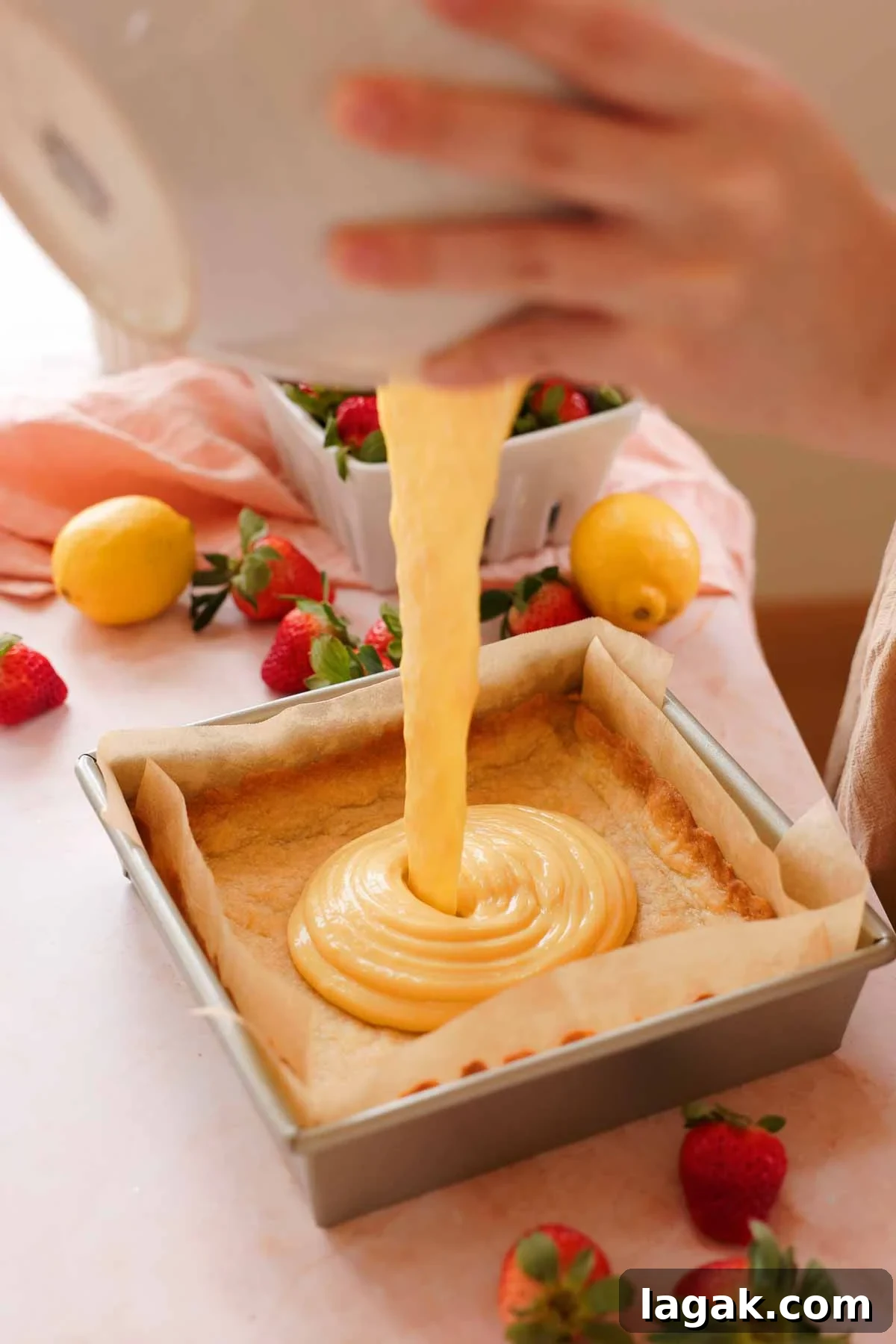 Strawberry Lemon Bars Recipe with Zesty Shortbread Crust 12 pouring lemon bar filling into baked shortbread crust
