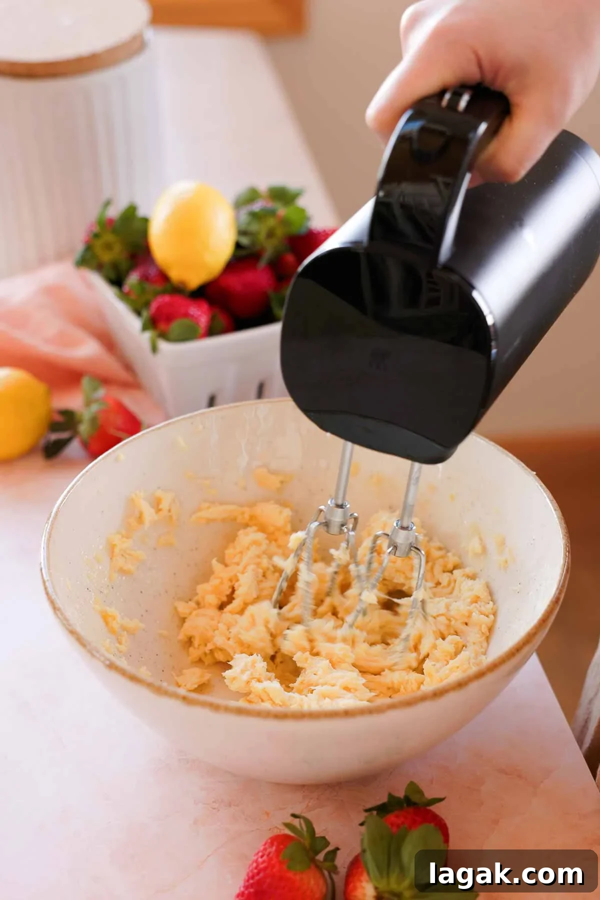 Strawberry Lemon Bars Recipe with Zesty Shortbread Crust 5 creaming butter and sugar together with electric mixer