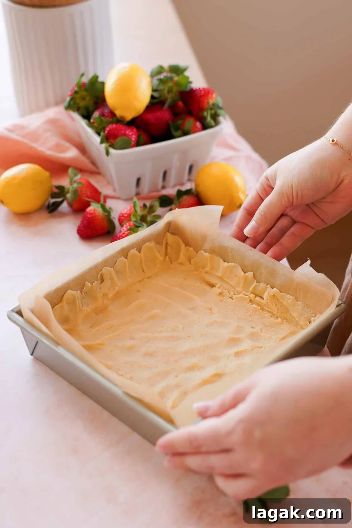 Strawberry Lemon Bars Recipe with Zesty Shortbread Crust 7 shortbread crust in square pan with crust up along the edges