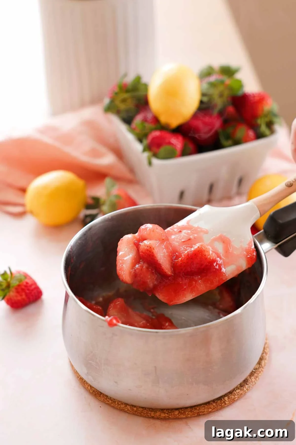 Strawberry Lemon Bars Recipe with Zesty Shortbread Crust 9 cooking strawberries down in a small saucepan