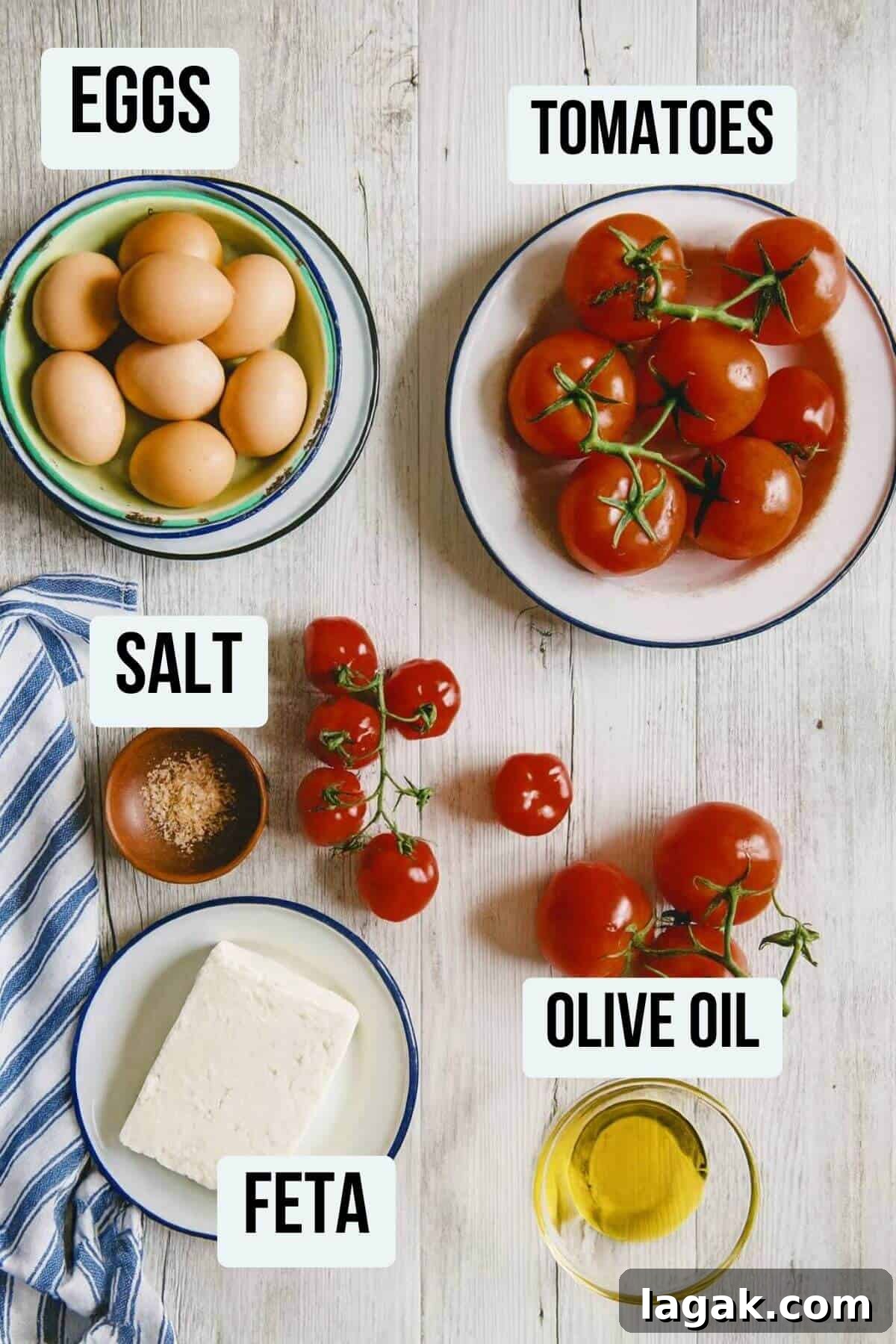 Strapatsada (Kagianas): Classic Greek Tomato Scrambled Eggs Recipe 4 Overhead photo showing ingredients for Greek strapatsada — eggs, tomatoes, feta cheese, olive oil, and salt.