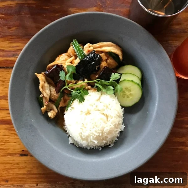 Top Portland Lunch Spots for Spring & Summer 2022 15 Thai comfort food in Portland at Paadee with a table of cashew chicken