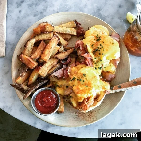 Top Portland Lunch Spots for Spring & Summer 2022 21 Eggs Benedict with ham at Besaws in Portland for brunch