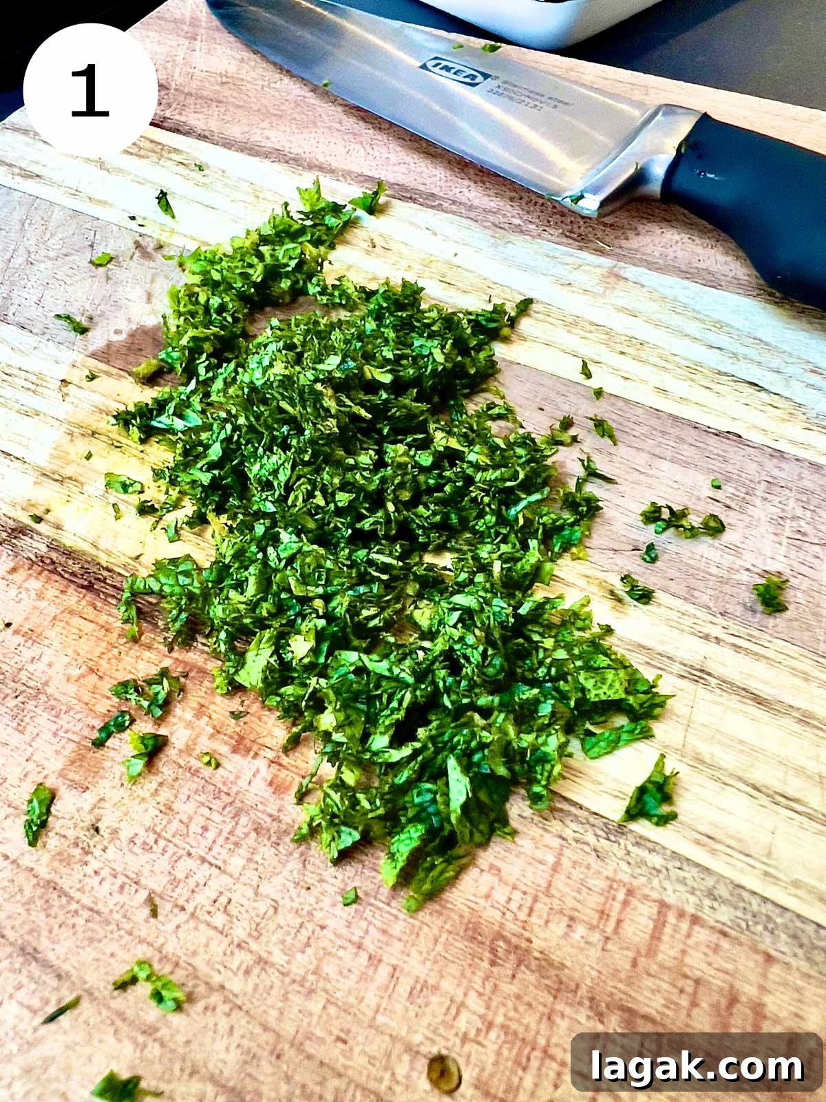 Chopped mint on a wooden chopping board and knife.