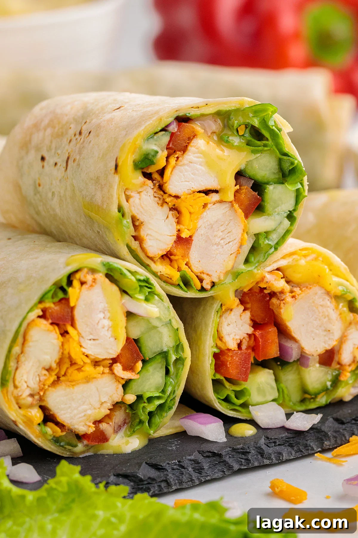 Honey Mustard Chicken Wrap Recipe: Quick Flavorful Lunch Idea 2 Three Honey Mustard Chicken Wraps stacked on top of each other.