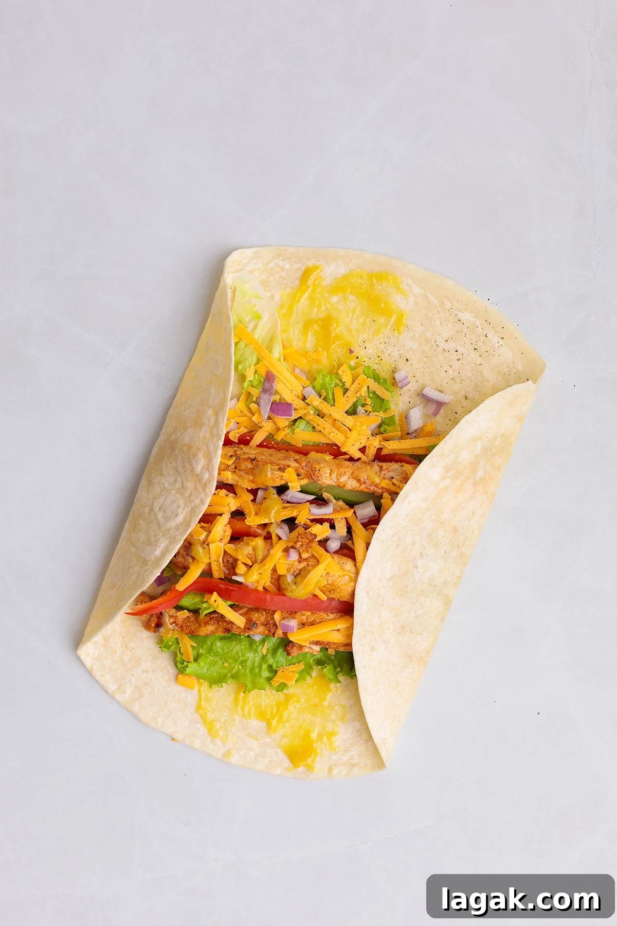 Honey Mustard Chicken Wrap Recipe: Quick Flavorful Lunch Idea 11 Folding in the sides of the flour tortilla around the honey mustard chicken filling.