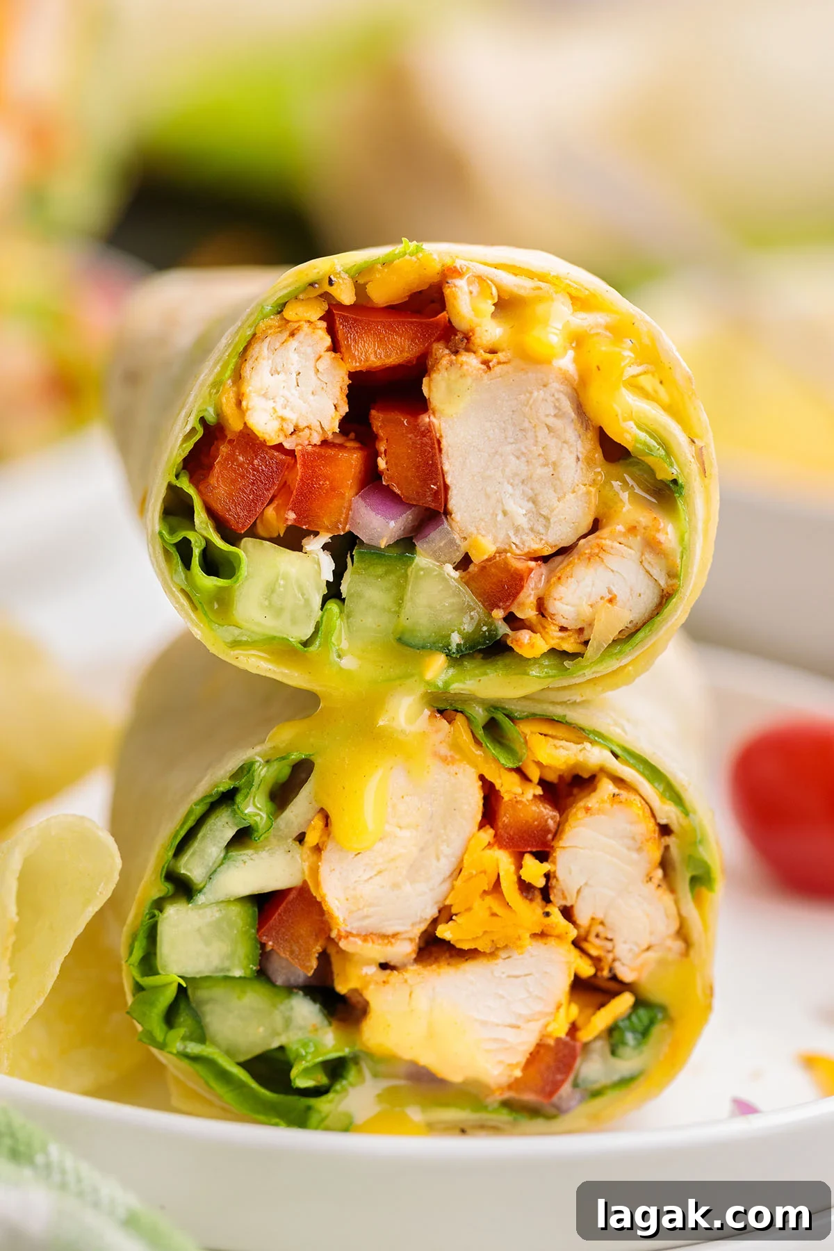 Honey Mustard Chicken Wrap Recipe: Quick Flavorful Lunch Idea 14 Honey Mustard Chicken Wraps stacked on a plate.