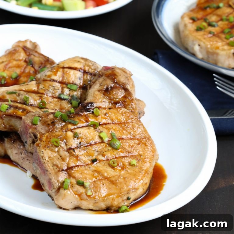 honey soy pork chops on a white platter