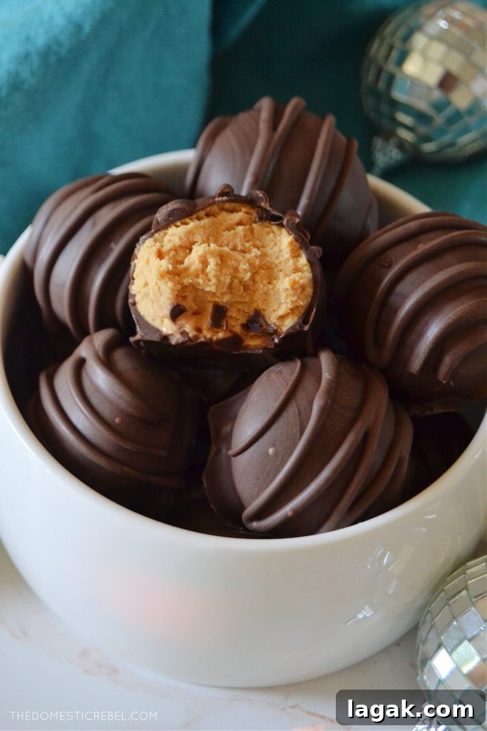 No-Bake Peanut Butter Balls Recipe for Quick Homemade Treats 6 a bowl full of peanut butter balls, one has a bite missing from it