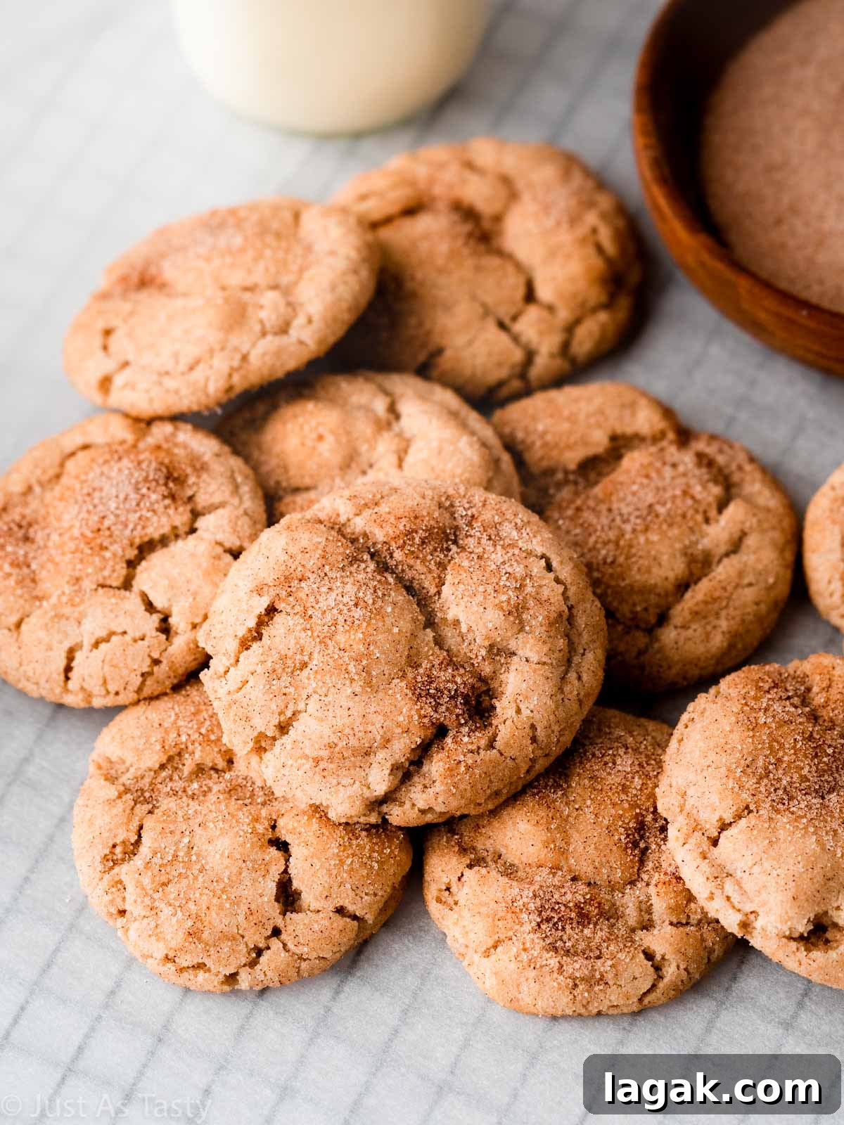 Gluten-Free Snickerdoodle Cookies: Soft Cinnamon Recipe 2 Gluten free snickerdoodles on parchment paper.