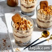 Speculoos (Biscoff) Tiramisu Recipe — Classic with Cookie Butter 6 Three glasses of speculoos tiramisu on a white background.