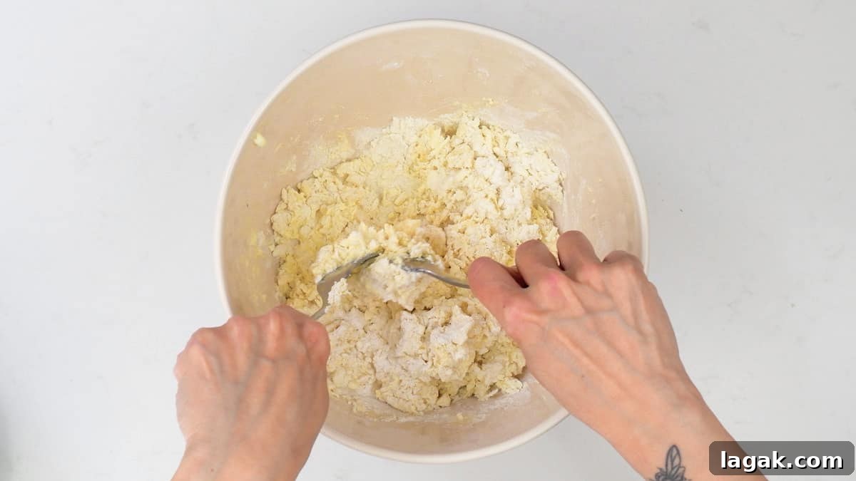 mixing scone dough using two forks