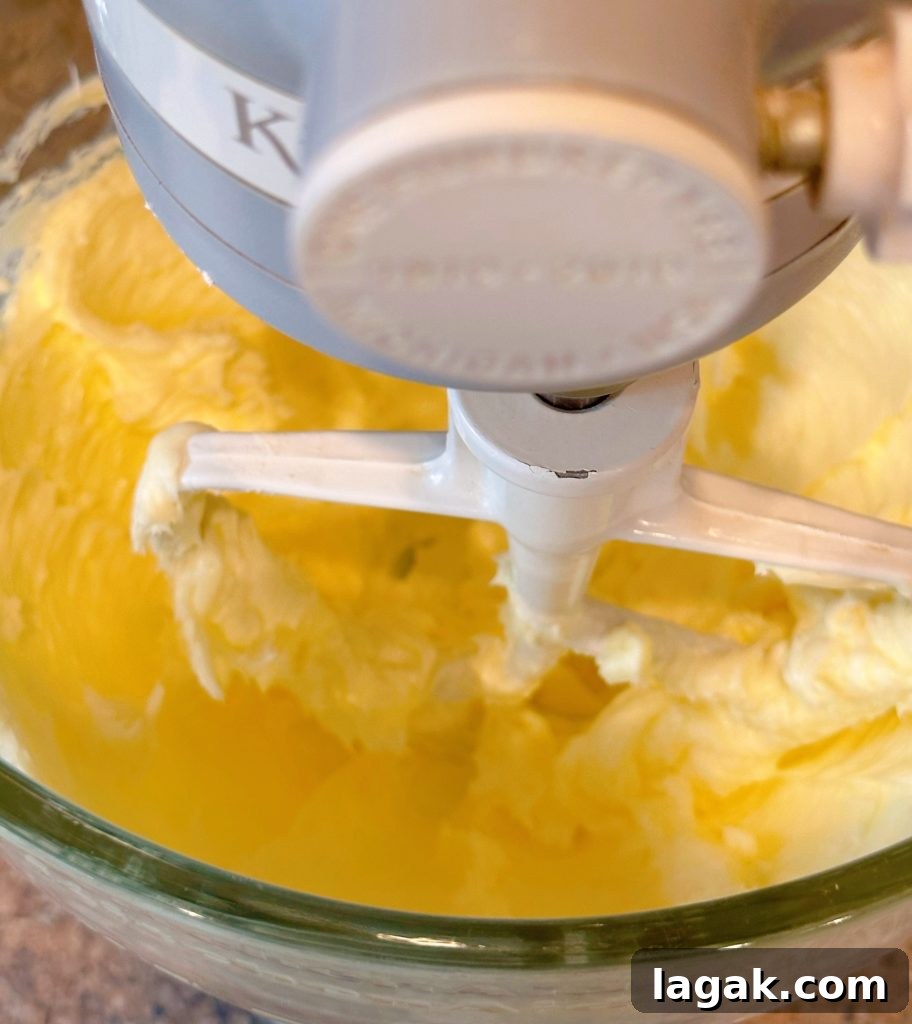 White Chocolate Macadamia Pudding Cookies Recipe 4 Creaming the butter in the bowl of the mixer.