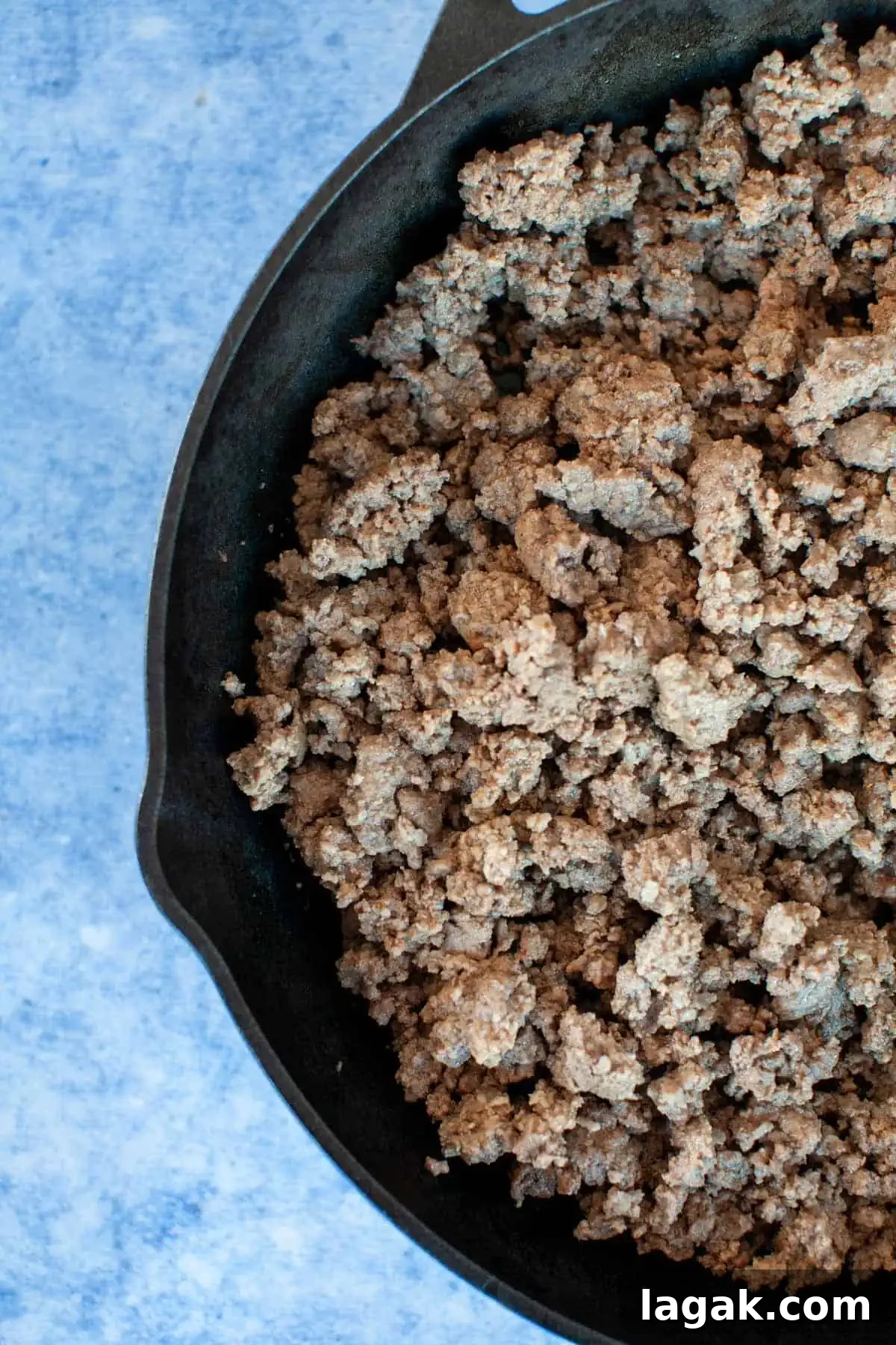 Authentic Ground Beef Tacos Recipe for Weeknight Dinners 4 Ground beef in a cast iron skillet.