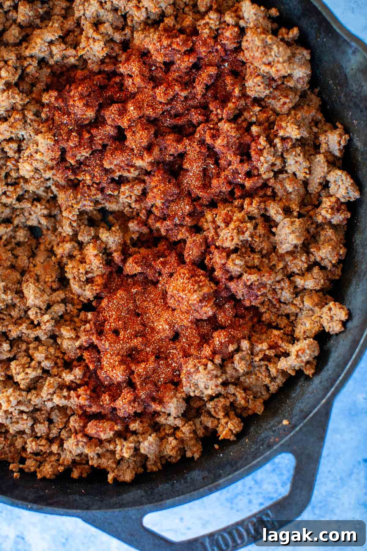 Authentic Ground Beef Tacos Recipe for Weeknight Dinners 6 A skillet filled with ground beef seasoned with taco seasoning.