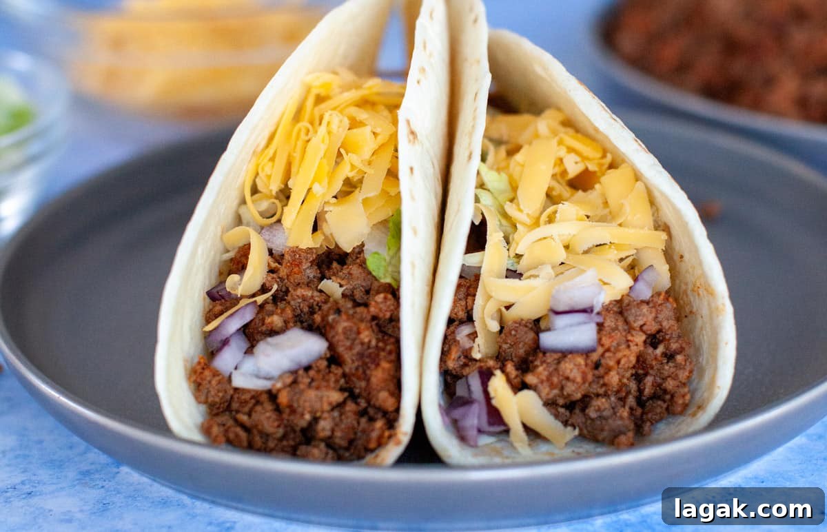 Authentic Ground Beef Tacos Recipe for Weeknight Dinners 8 Ground beef tacos in flour tortillas.