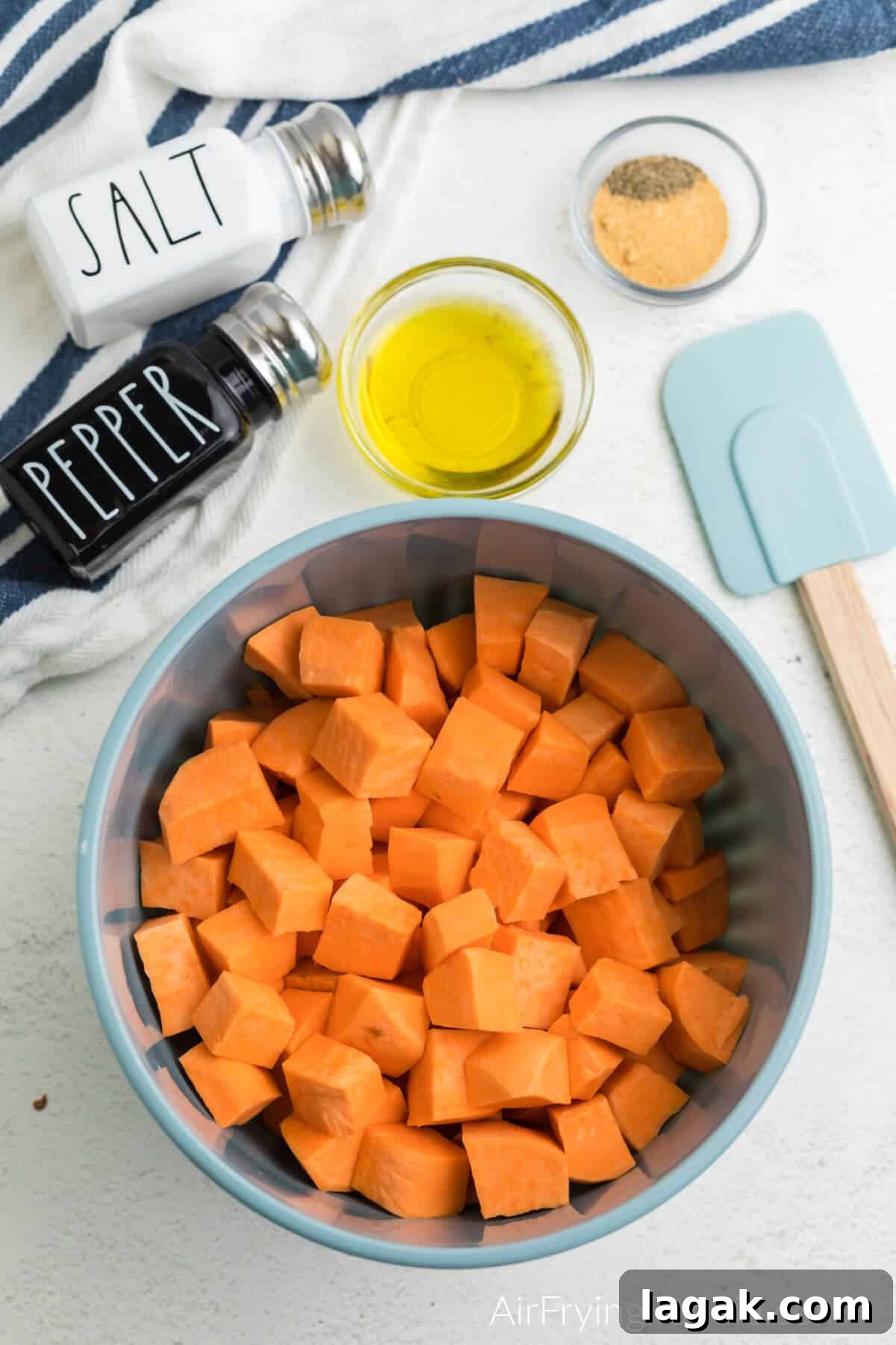 Crispy Air Fryer Sweet Potato Cubes Recipe 7 Step 3 season potatoes