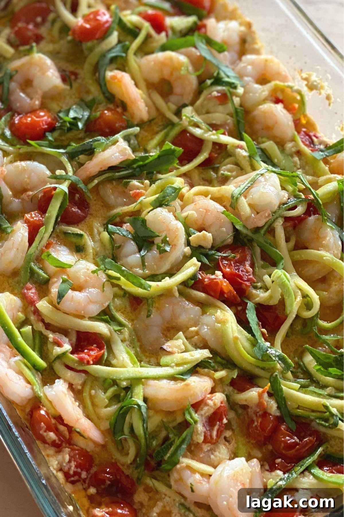 Shrimp and Zoodle Baked Feta Pasta with Garlic Lemon Sauce 5 Finished recipe in a glass baking dish.