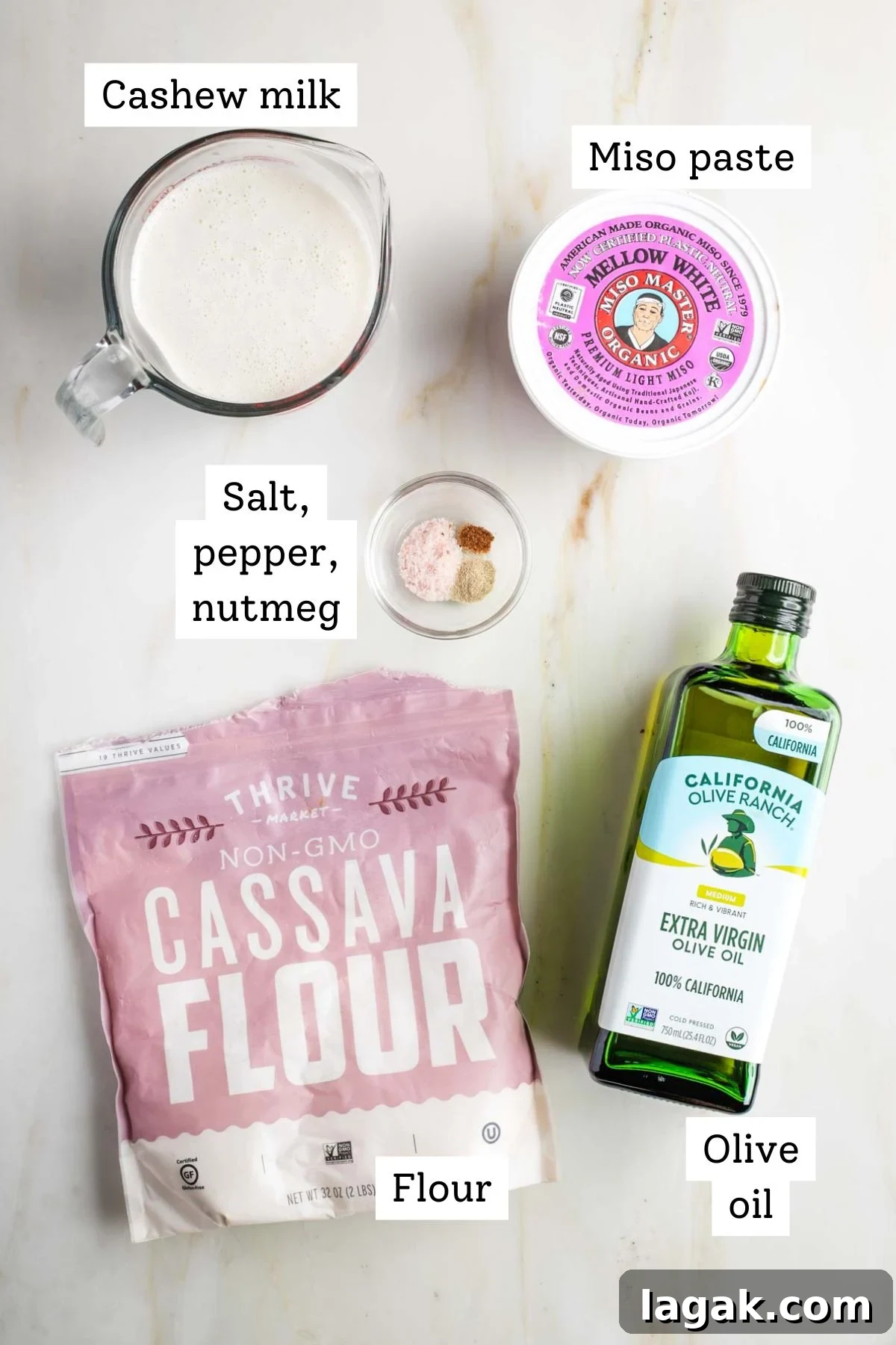 Ingredients for vegan bechamel displayed on a surface.