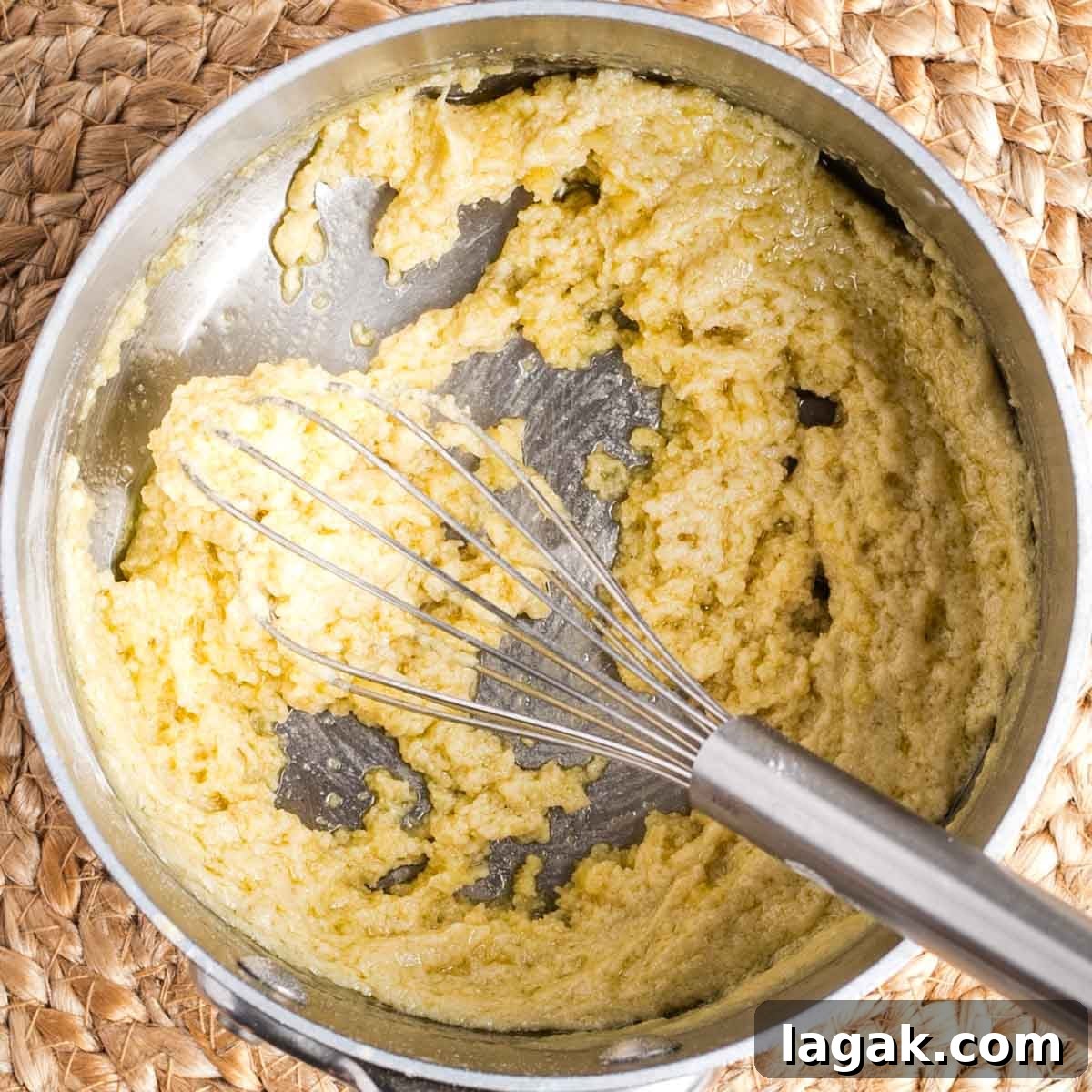 Whisk stirring super thick and pasty pale yellow mixture in a small saucepan.