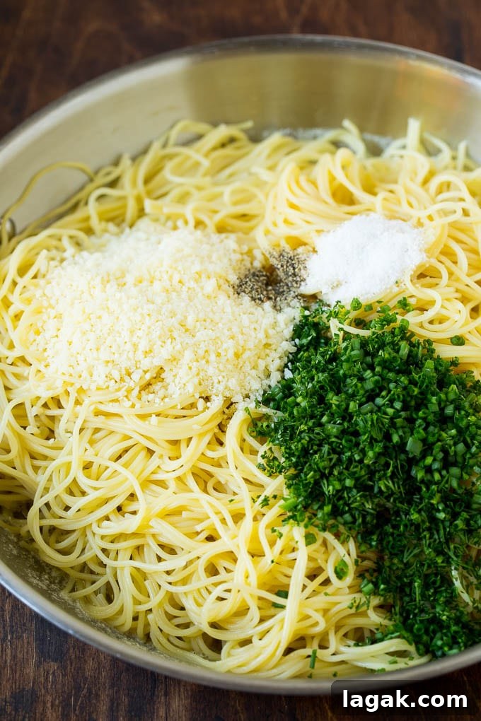 Angel Hair Pasta with herbs and cheese Pasta topped with herbs, cheese, salt and pepper.