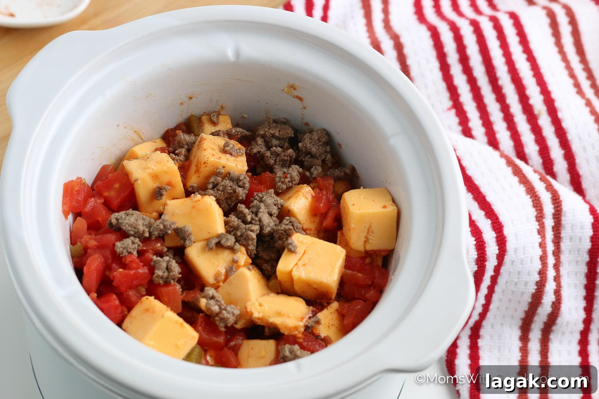 4-Ingredient Crockpot Rotel Dip Recipe for Game Day 5 Cheese, Rotel, Ground Beef in crockpot
