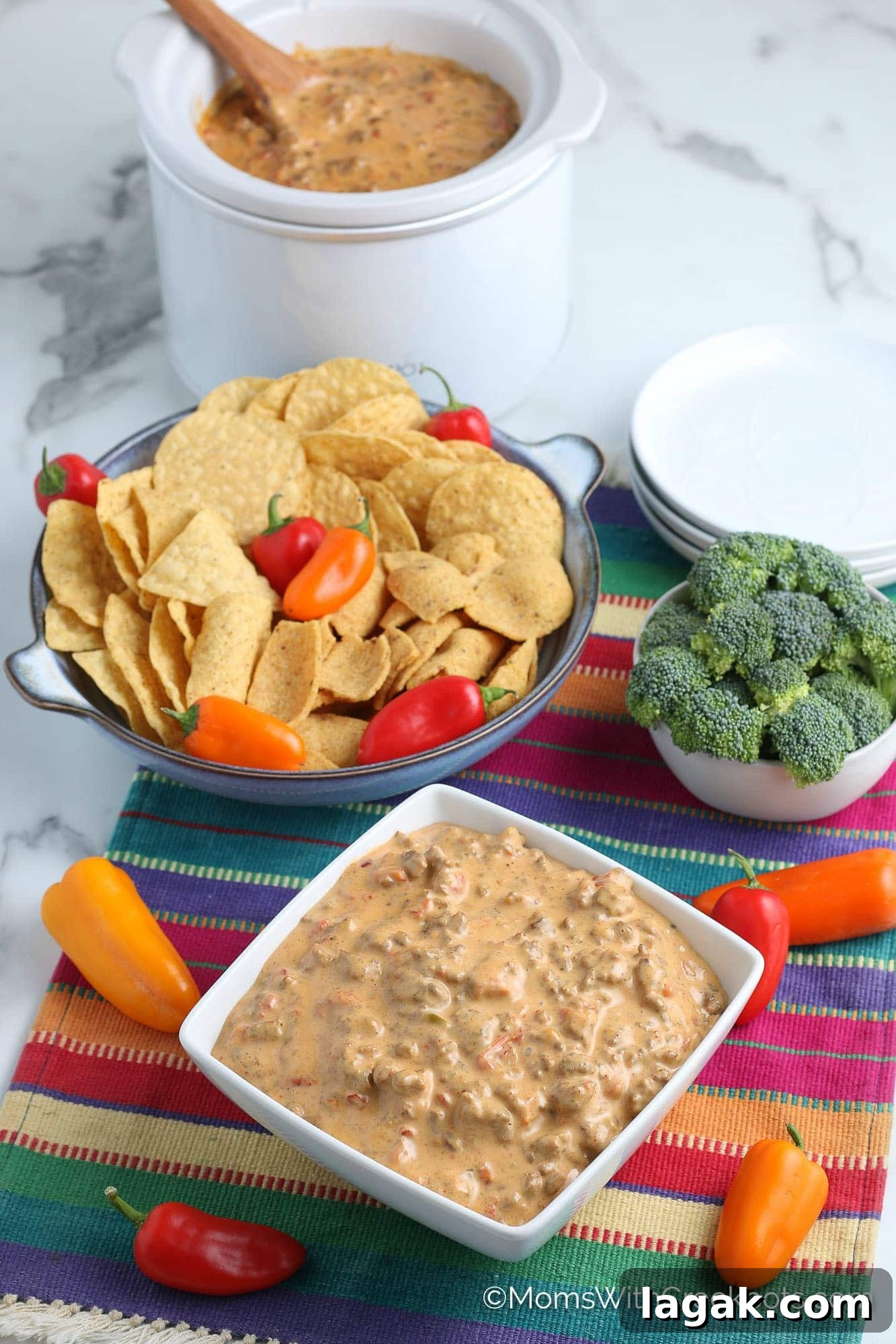 4-Ingredient Crockpot Rotel Dip Recipe for Game Day 6 Rotel Dip with Crockpot in background, chips, and broccoli