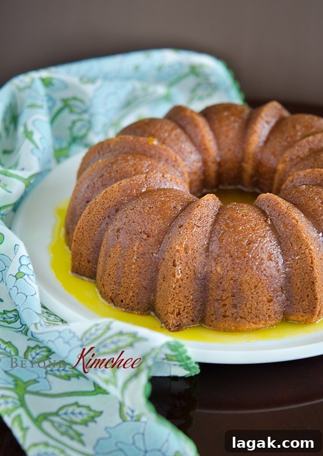 Orange-Cake-1 Orange cake with homemade orange sauce on a platter.
