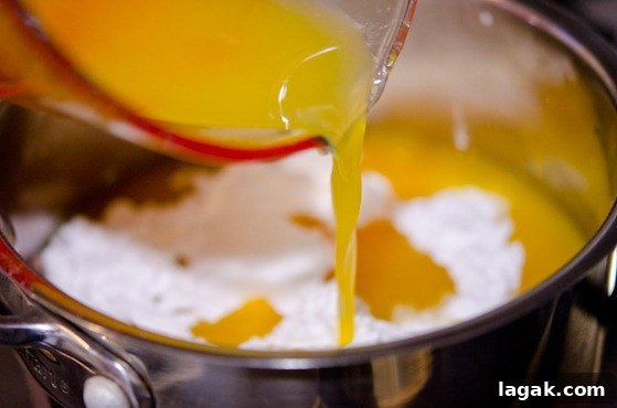 tutorial_-12 Fresh squeeze orange juice is added to sugar and lemon juice in a pan.
