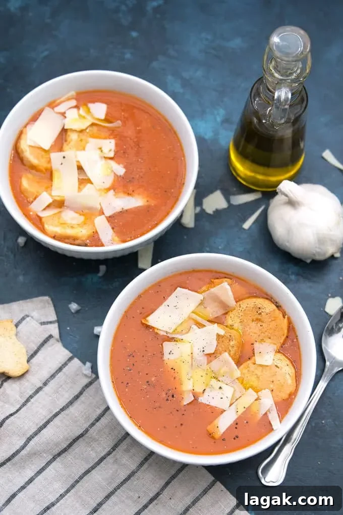 picture of two bowls of roasted garlic tomato soup