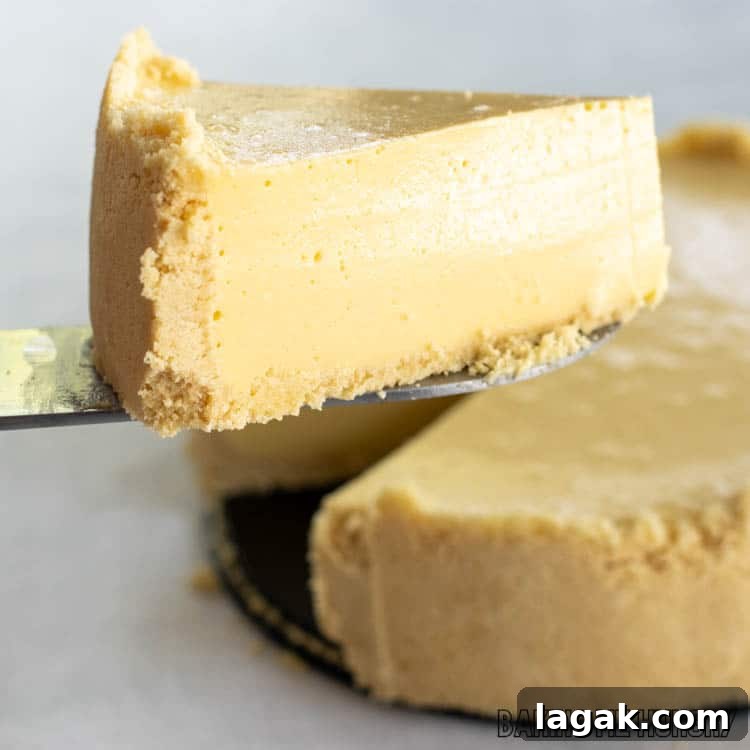 server lifting up a slice of the cheesecake