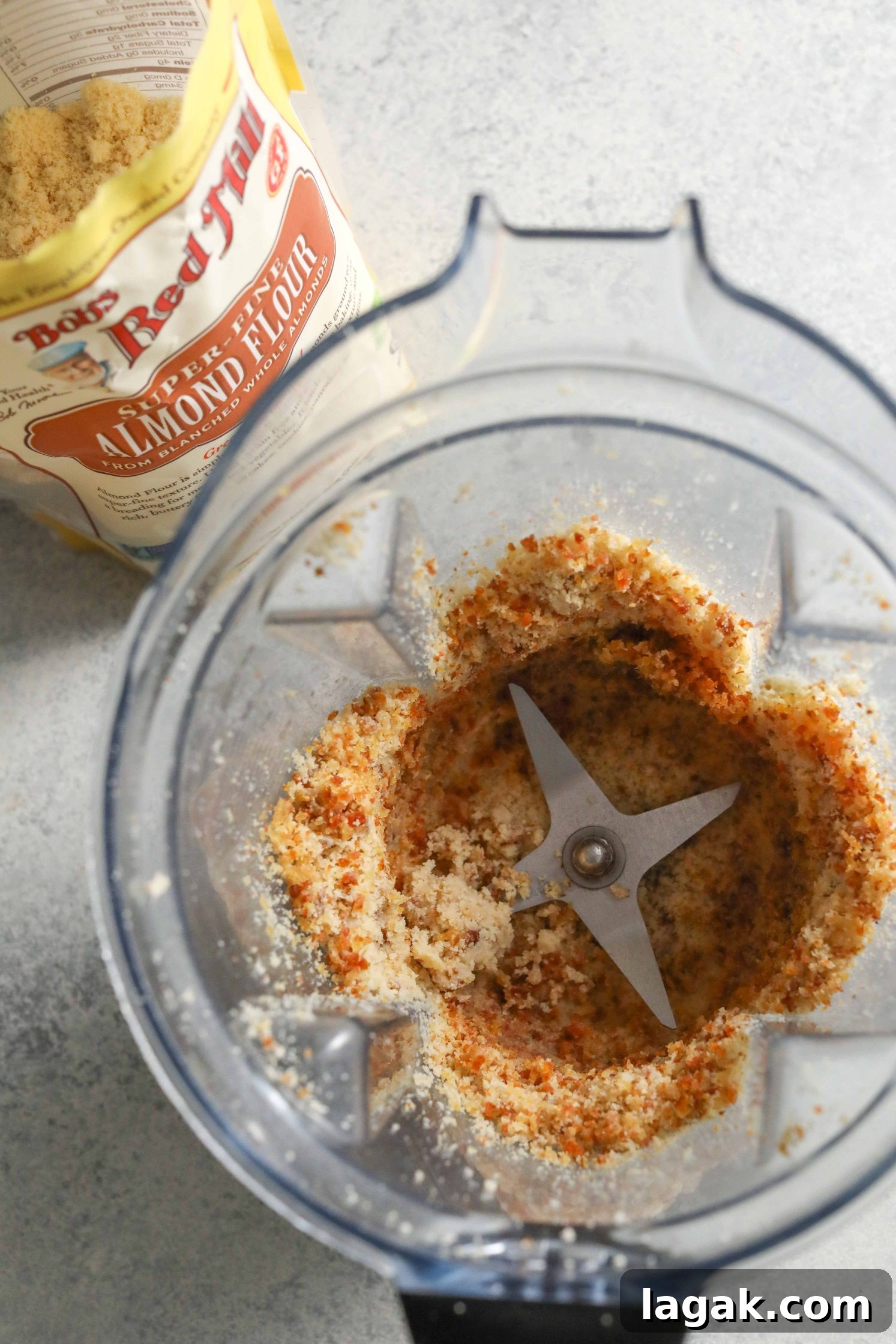 Chewy Pecan Pie Bars with Buttery Shortbread Crust 4 grain-free pie crust in blender with Bob's Red Mill Almond Flour on side by Flora & Vino