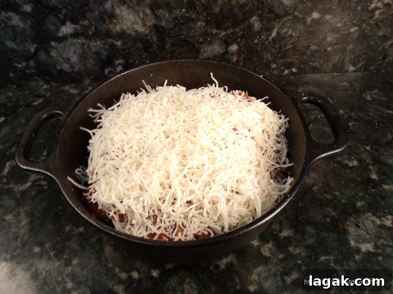 Spicy Bratwurst Chili Casserole Recipe for Crowd Meals 4 Sprinkle Cheese on Top of Chili