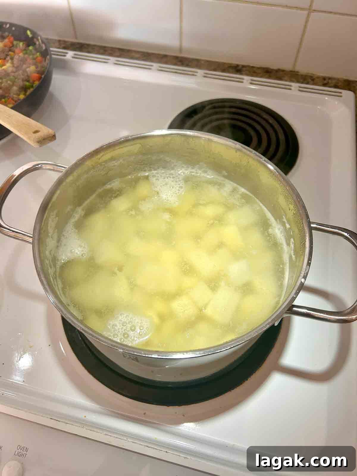 potatoes boiling in pot.