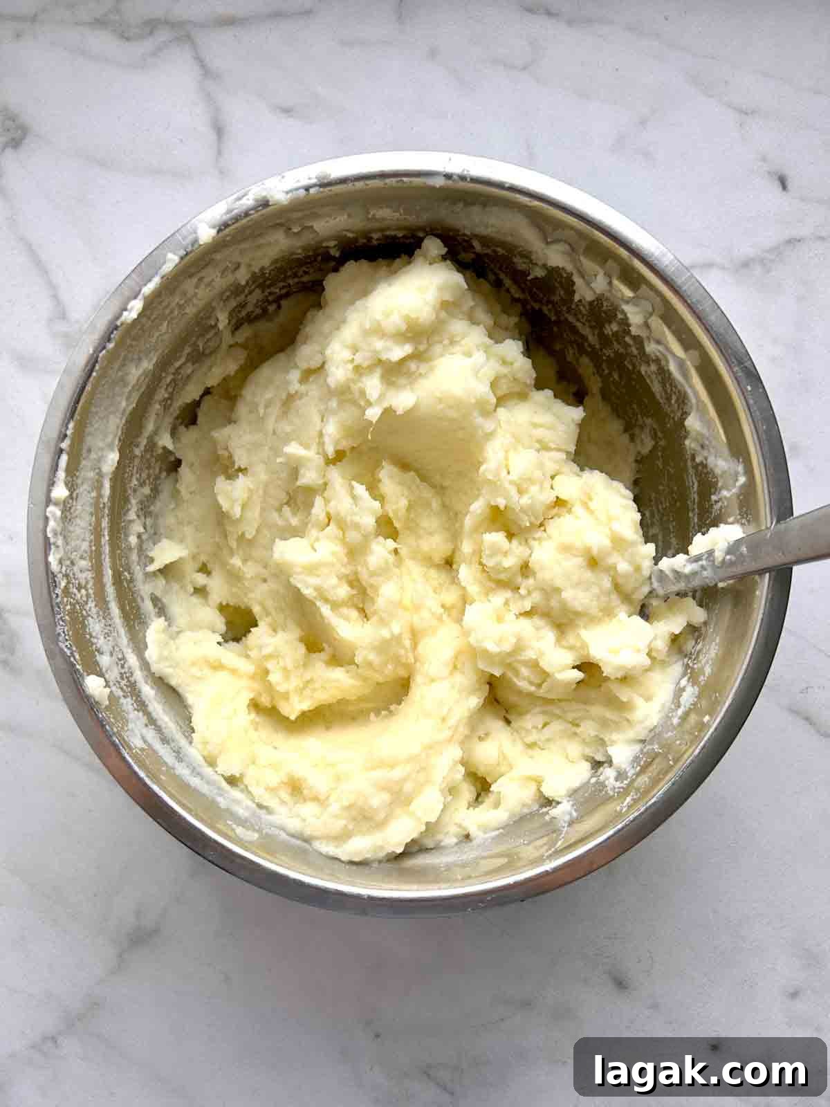 potatoes mashed in bowl with butter and milk.