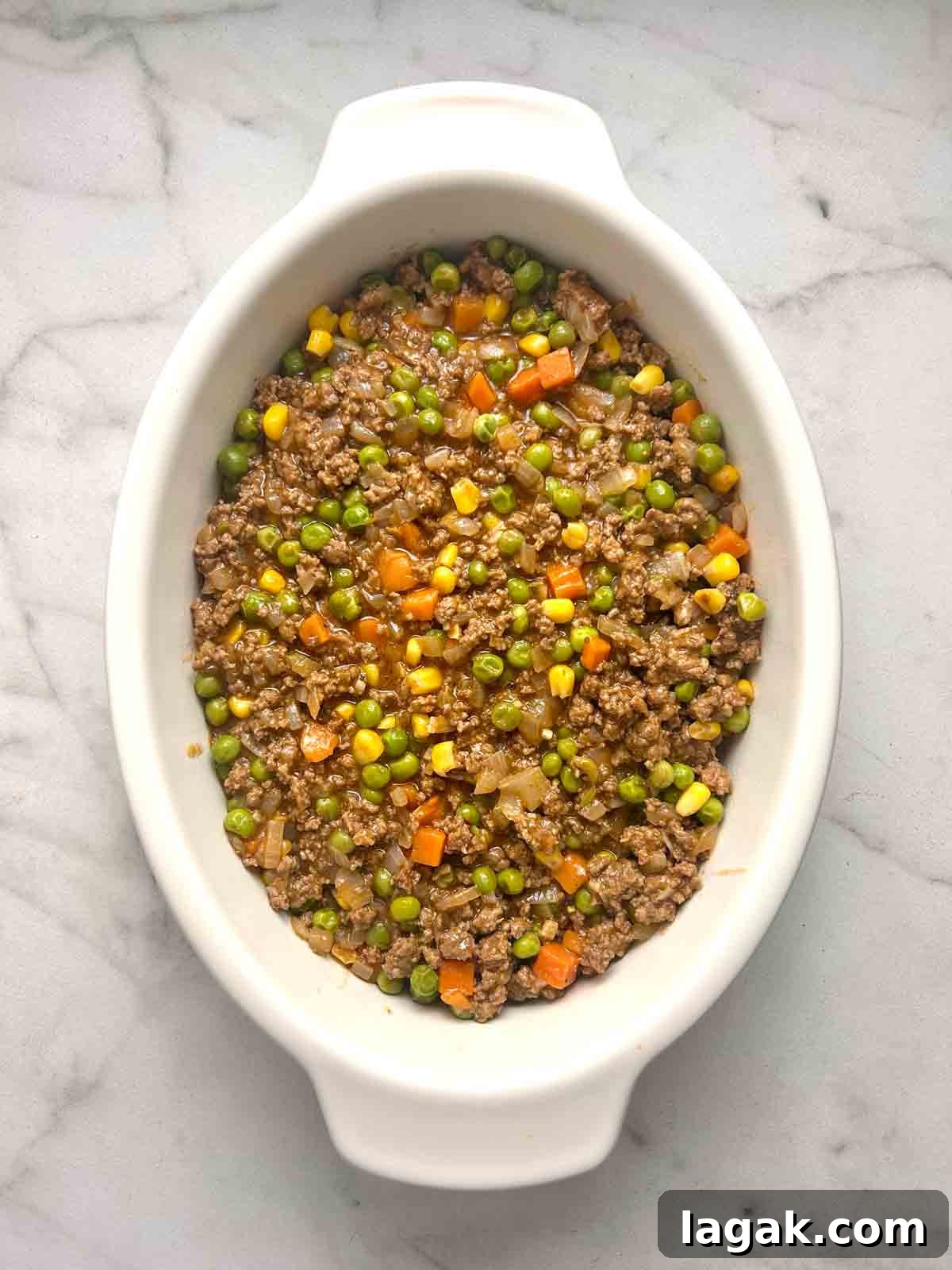 meat layer added to baking dish.