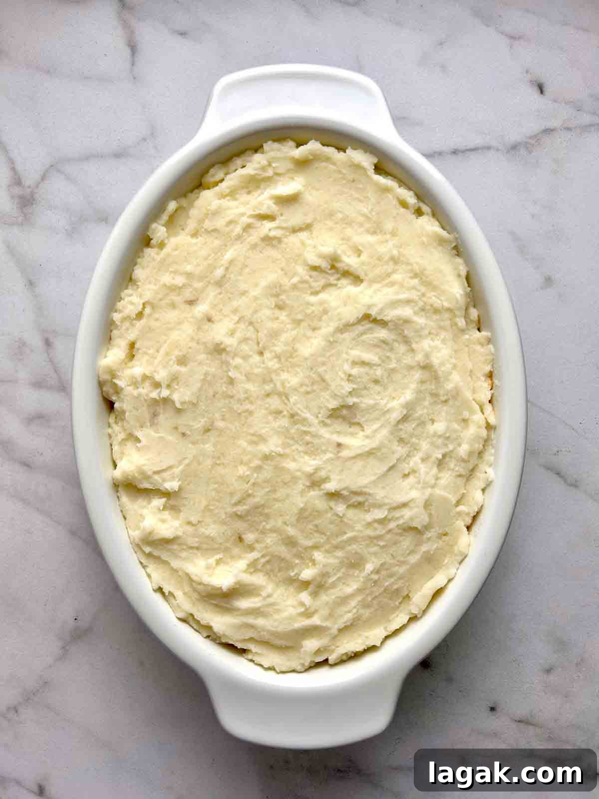 potato layer added on top of meat filling.