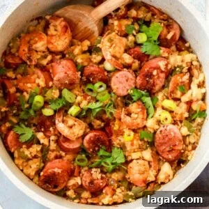 Whole30 Jambalaya: Spicy Cajun Chicken & Sausage Recipe 2 overhead view of a white pot containing whole30 jambalaya