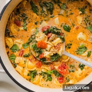 This Creamy Tortellini Soup recipe is cozy, comforting and made with tender cheese tortellini, fresh veggies, herbs and a rich creamy broth. The perfect one pot meal that is both flavorful and satisfying!