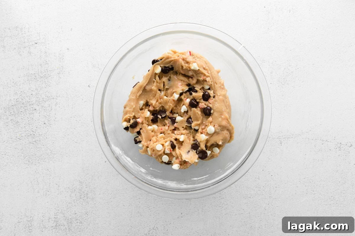 Peppermint Chocolate Chip Cookie Recipe: Crisp, Minty Holiday Cookies 7 chocolate chip peppermint cookie dough in a glass bowl.