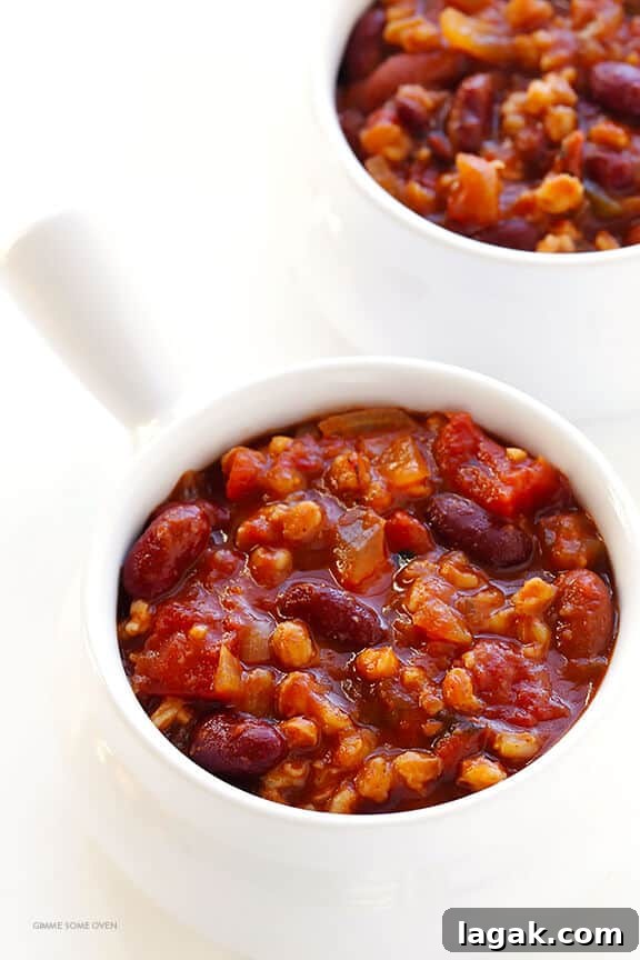 Slow Cooker Hearty Vegetarian Chili Recipe 5 Slow Cooker Vegetarian Chili Recipe -- easy to make in the crock pot or on the stovetop, naturally gluten-free and vegan, and SO delicious! | gimmesomeoven.com