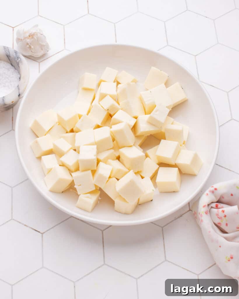 Homemade Paneer: Step-by-Step Recipe for Fresh Indian Cheese 2 Paneer Cubes in plate.