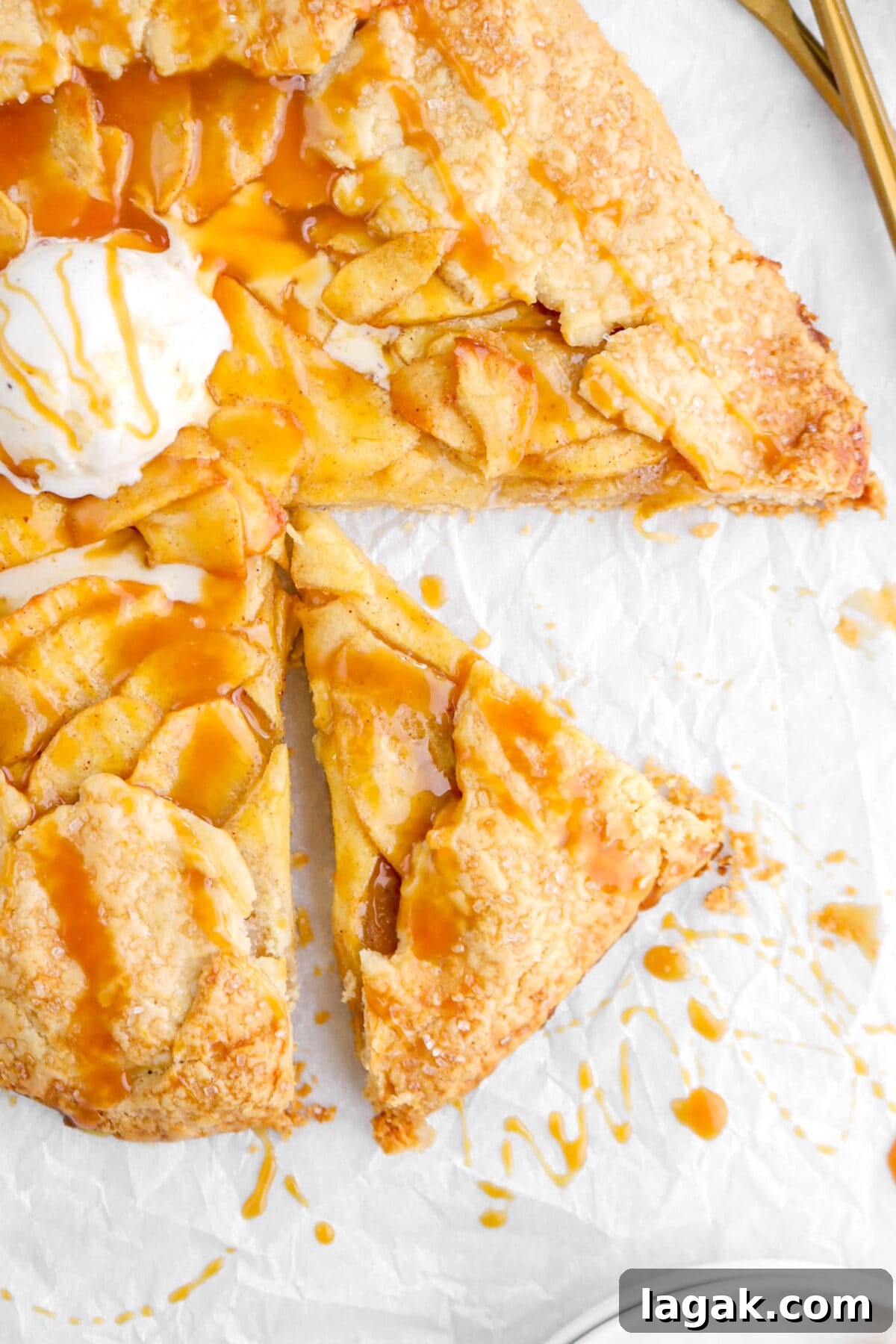 Caramel Apple Galette Recipe: Rustic Fall Dessert with Salty Caramel 3 close up of slice of galette on parchment paper