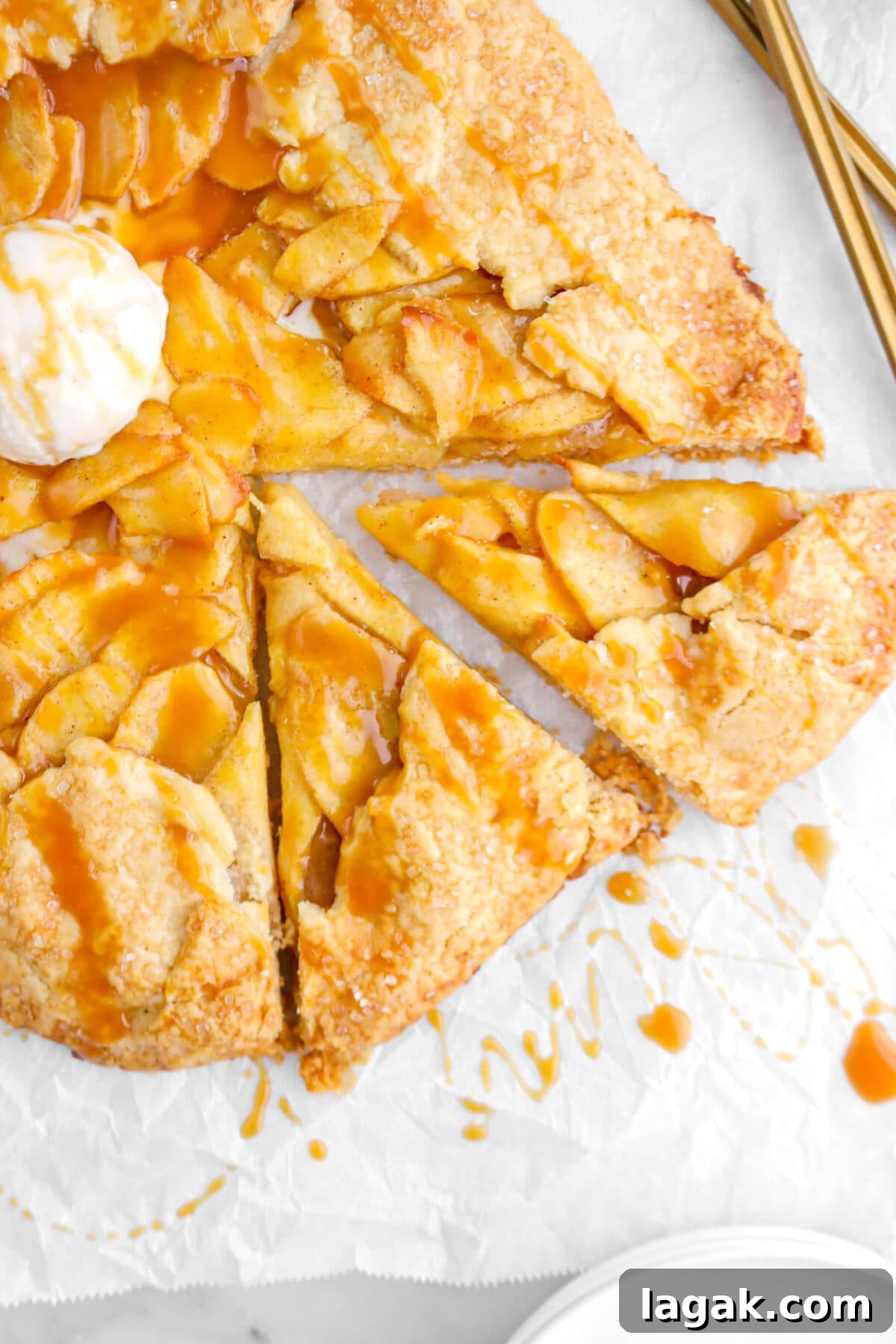 Caramel Apple Galette Recipe: Rustic Fall Dessert with Salty Caramel 21 close up of two slices of galette on parchment paper